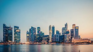 Singapore Marina Bay financial district skyline at sunset showcasing modern office buildings and towers that house private equity firms and asset managers
