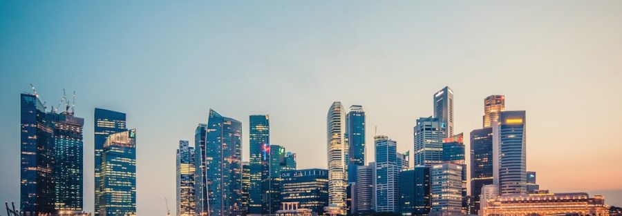 Singapore Marina Bay financial district skyline at sunset showcasing modern office buildings and towers that house private equity firms and asset managers