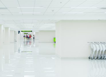 photo-1518235461080-01779c3c1167.jpg Modern hospital hallway representing healthcare investment opportunities in Thailand. Photo by Unsplash