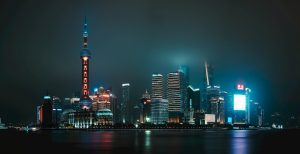 Shanghai skyline at night representing China's technology and financial hub. Photo by Unsplash
