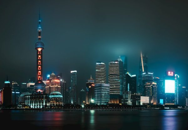 Shanghai skyline at night representing China's technology and financial hub. Photo by Unsplash