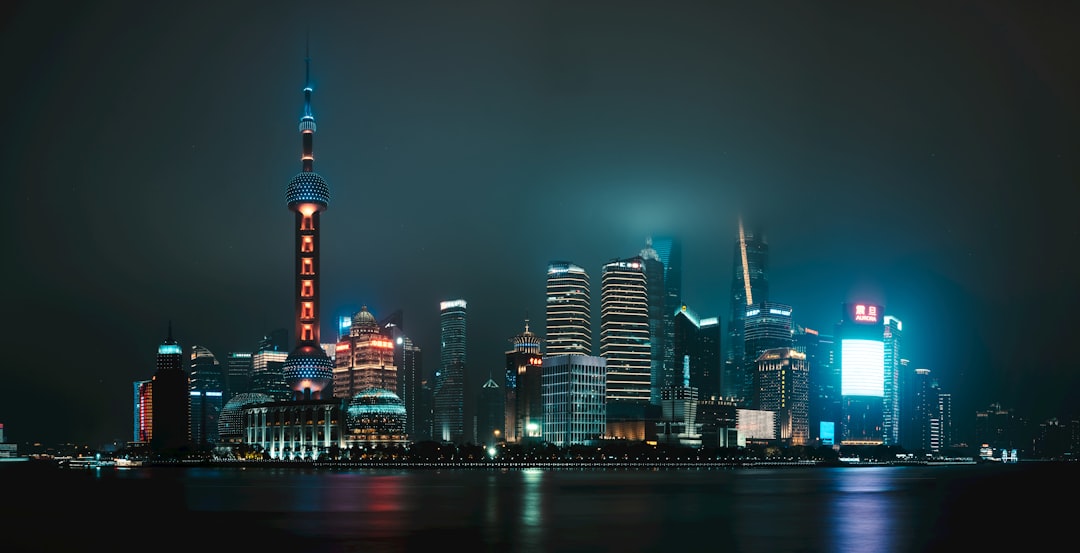 Shanghai skyline at night representing China's technology and financial hub. Photo by Unsplash
