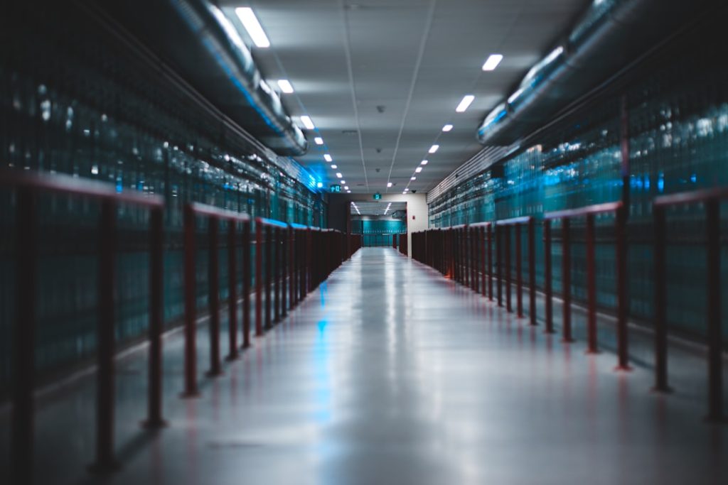 Modern data center hallway with server racks showing digital infrastructure development