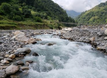 photo-1756745887602-4d2a811c0e02.jpg Rocky river through the Himalayas showing Nepal's hydropower potential