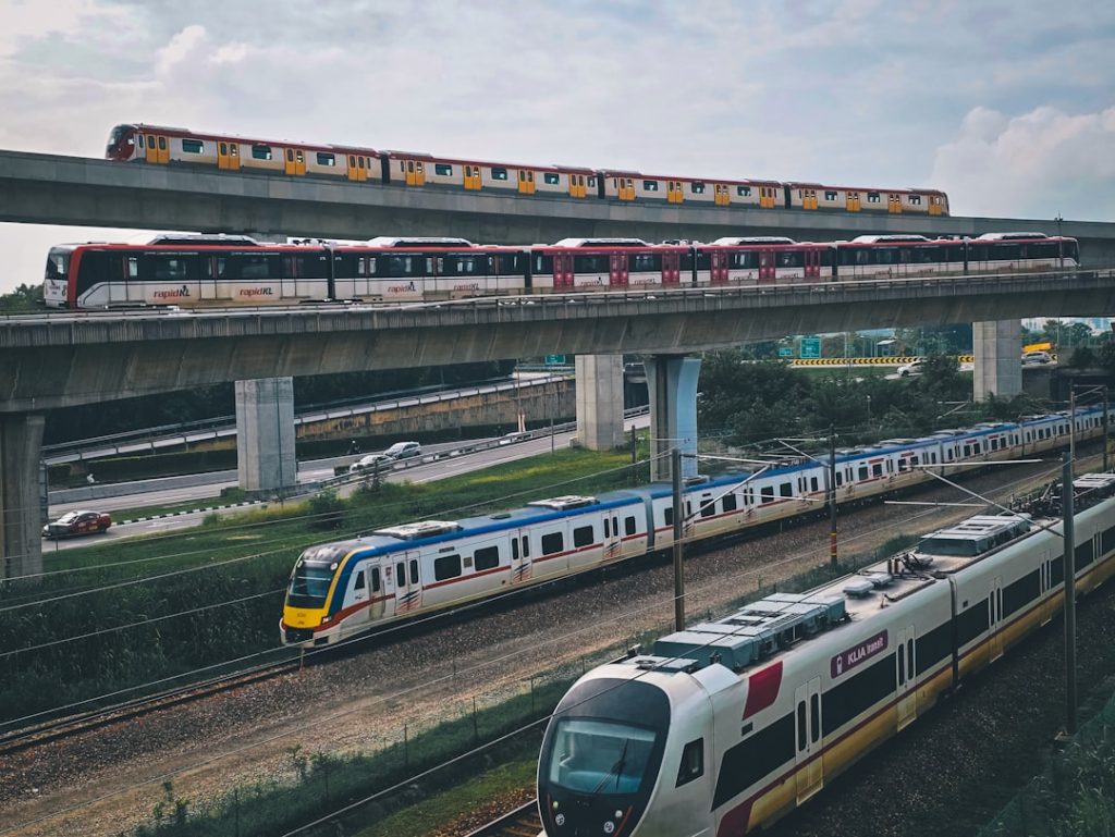 Modern trains on elevated railway tracks showing Malaysia's rail infrastructure development